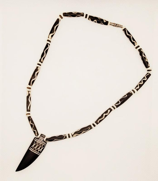 Mud Bone Necklace with Carved Pendant